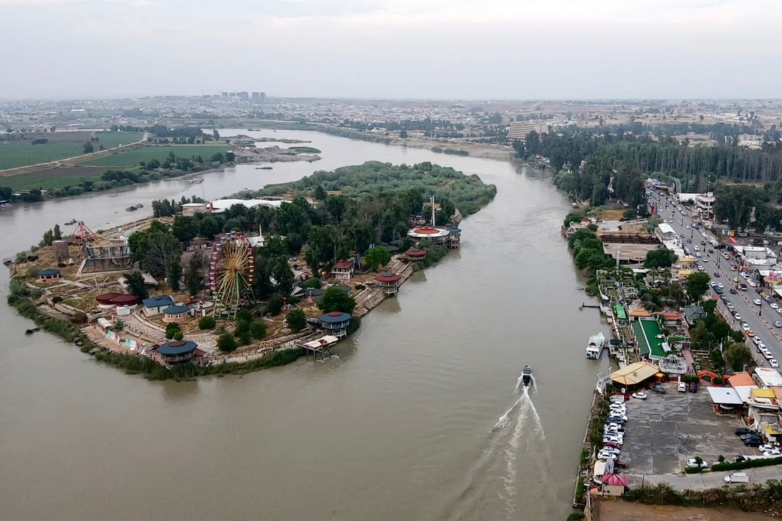 This aerial view shows Iraq's Tigris river overflowing after recent heavy rains and a release of excess water from the Mosul dam, in the northern city of Mosul on May 3, 2024. (Photo by Zaid AL-OBEIDI / AFP)