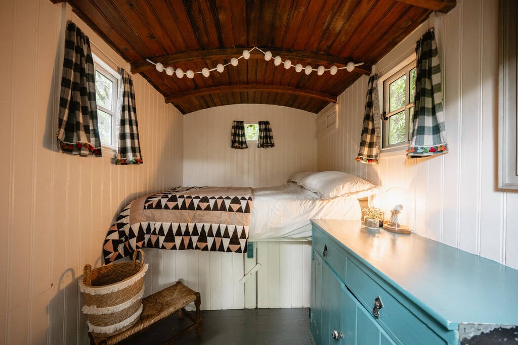 Double bed inside and a wood burner