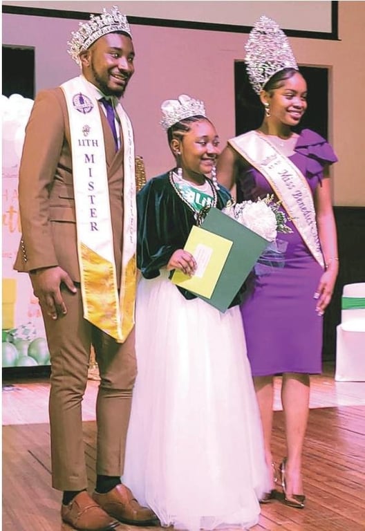 The winner Little Miss Green and White 2024 Abigail T. Priester along with along the Master and Mistress of Ceremonies, Mr. Benedict-Malik Hudson and Miss Benedict-Autumn Tisdale.