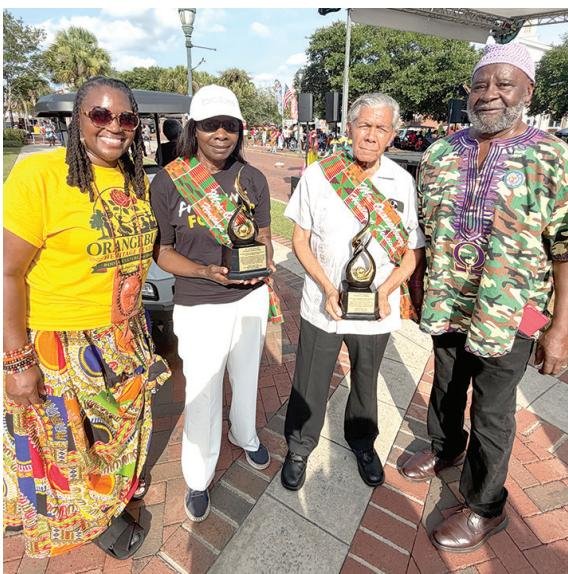 Barbara & Cecil Williams (center)