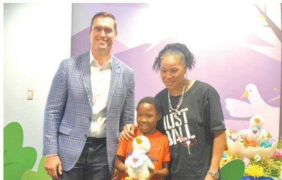 Coach Dawn Staley swaps Gamecocks for My Special Aflac Duck