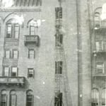 Ladderman Gilbert W. Jones, Ladder Co. 15, training on the Drill Tower, 60 Bristol Street, South End, in 1921.