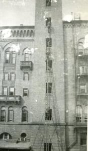 Ladderman Gilbert W. Jones, Ladder Co. 15, training on the Drill Tower, 60 Bristol Street, South End, in 1921.