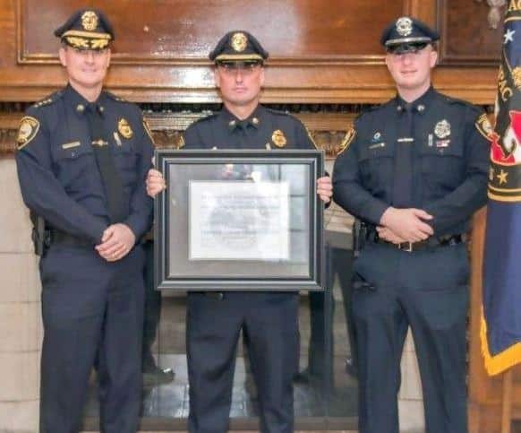  Chief Edward Conley, Lieutenant Fitzgerald and Officer Ryan Machain stand with certification