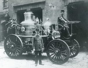 Engine 35's 1898 Amoskeag self-propelled steamer & Capt. John T. Byron at 18 Mason St., Downtown c. 1898.