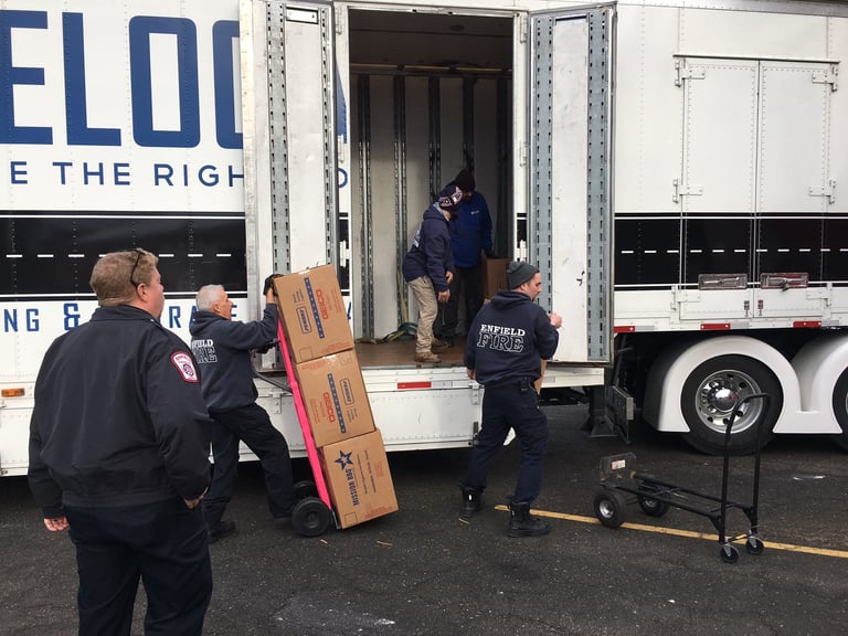 Enfield Firefighters Assist in Unloading Wreaths for Wreaths Across America Ceremony
