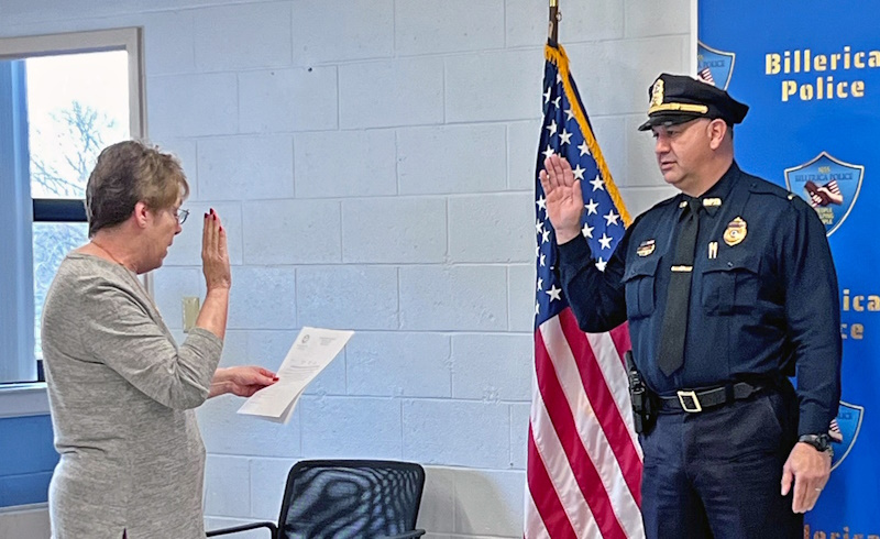 Town Clerk Donna McCoy swears in Lt. John Zarro to the position of lieutenant.