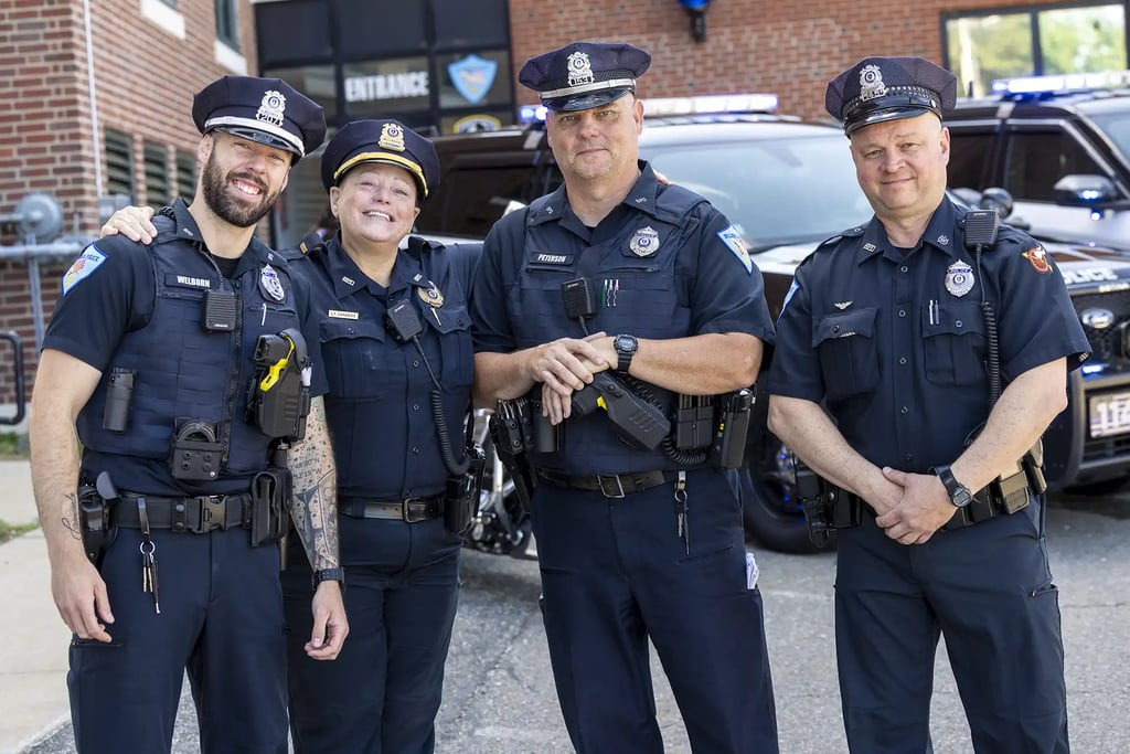 Four Billerica Police officers pose for a photo.