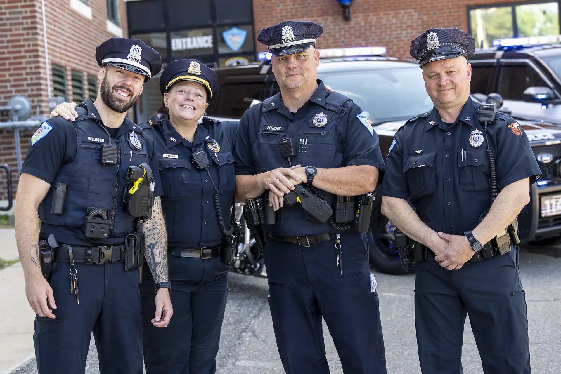 Four Billerica Police officers pose for a photo.
