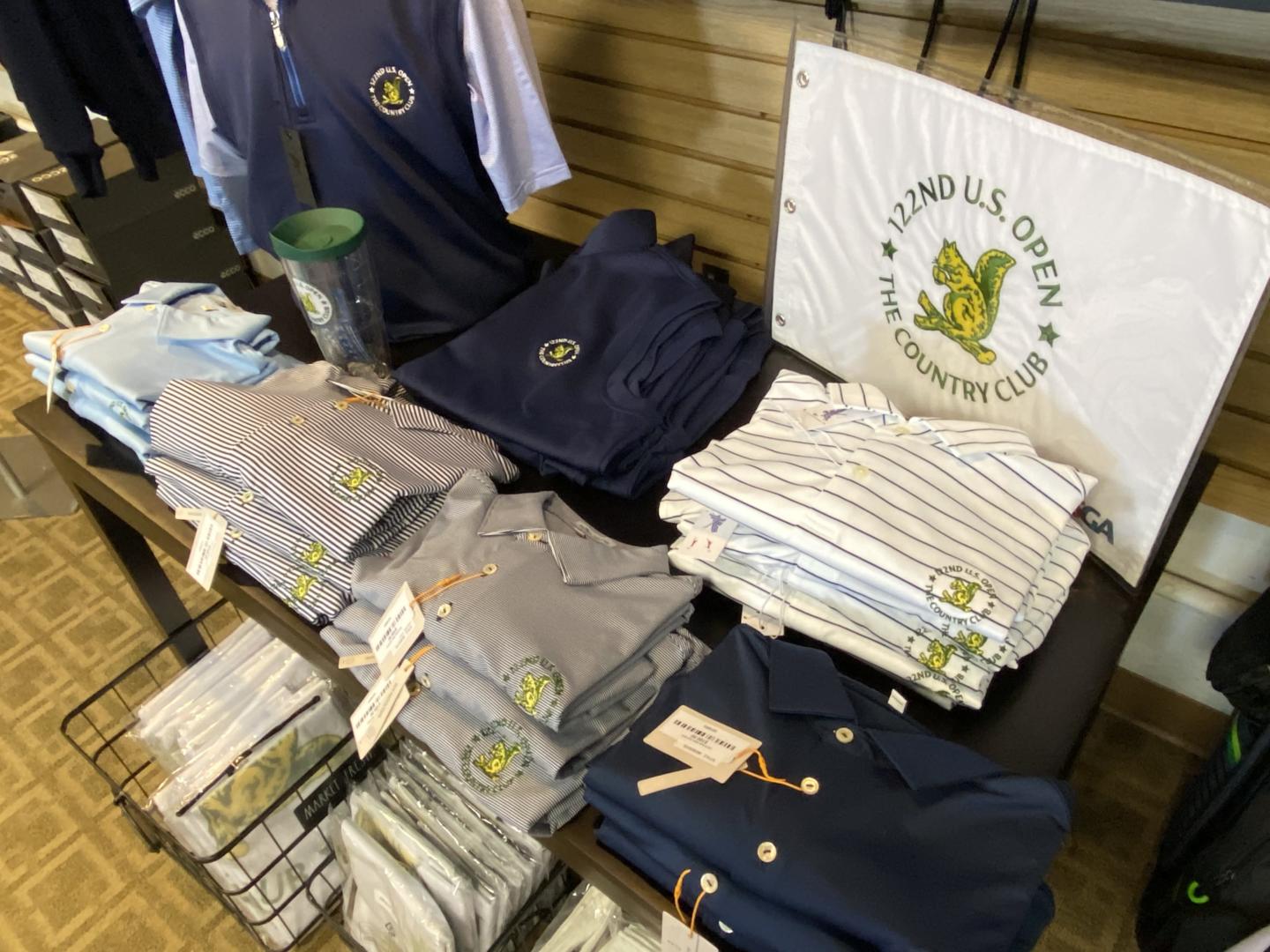 U.S. Open-branded apparel is available in the pro shop of Brookline Golf Course, with proceeds supporting local Brookline non-profits and community groups.