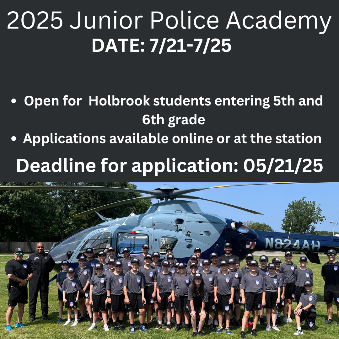 Junior Police Academy participants standing in front of a helicopter