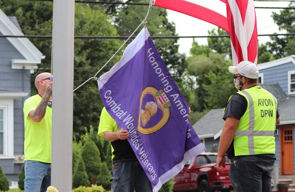 The Town of Avon's Purple Heart designation flag is raised during a ceremony in August 2020. (Photo courtesy Town of Avon)