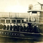 Lieutenant John Williams, 2nd from right, aboard Fireboat 'Thomas A. Ring', Engine 31, circa 1916.