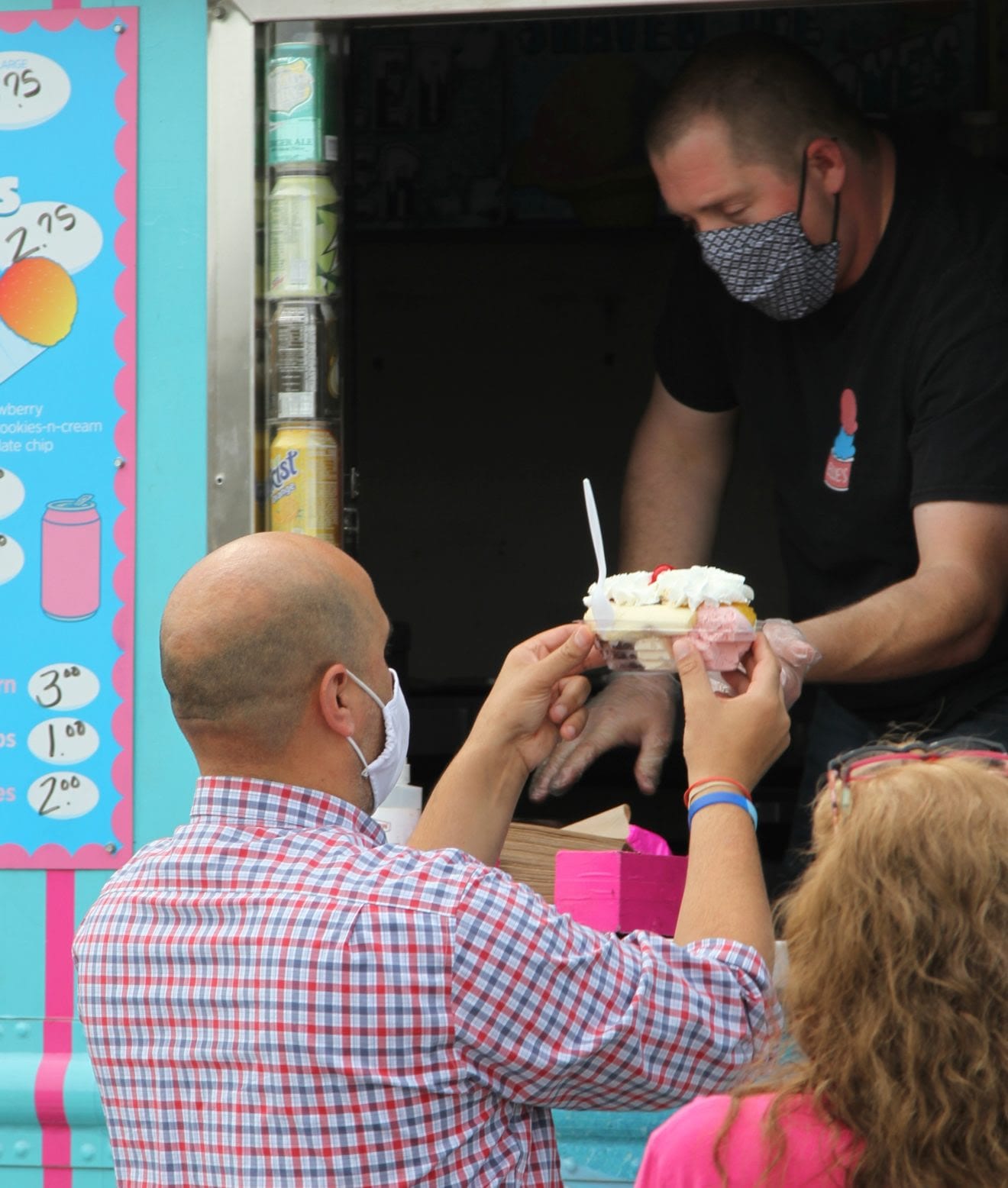 Town Administrator Gregory Enos picks up his ice cream at the window. (Photo courtesy Town of Avon)