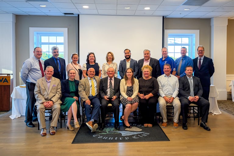 John M. “Jack” Jones, center, is joined by attendees of the MAVA Annual Awards and Retiree Recognition Dinner who participated in MAVA Leadership Academy II during his 15 years as program coordinator. Jones helped prepare aspiring superintendents and assistant superintendents to lead vocational-technical schools across Massachusetts.