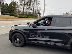 Traffic unit police member in a patrol car.