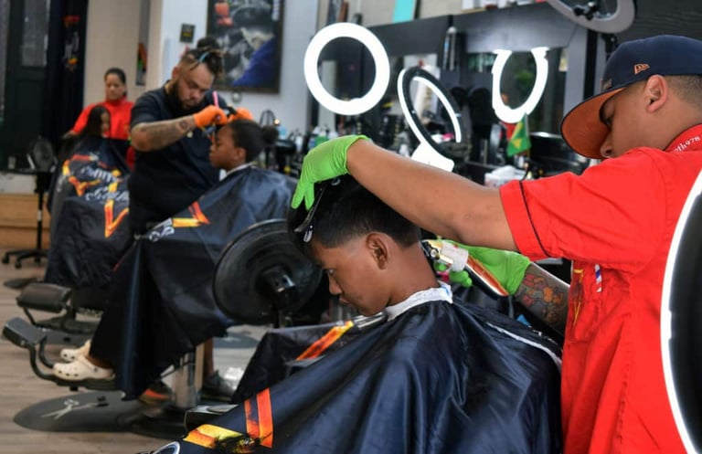 *PHOTOS* Barber Provides Free Haircuts to Youth in Lowell Police Youth Services Boxing Program
