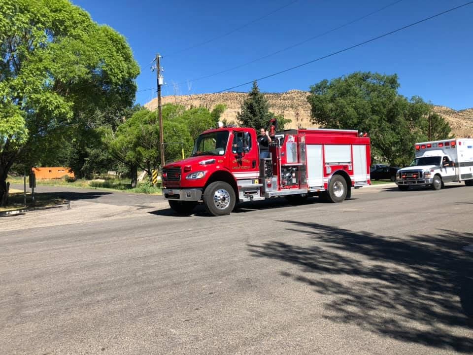 Emery Volunteer Fire Department truck participates in a town parade.
