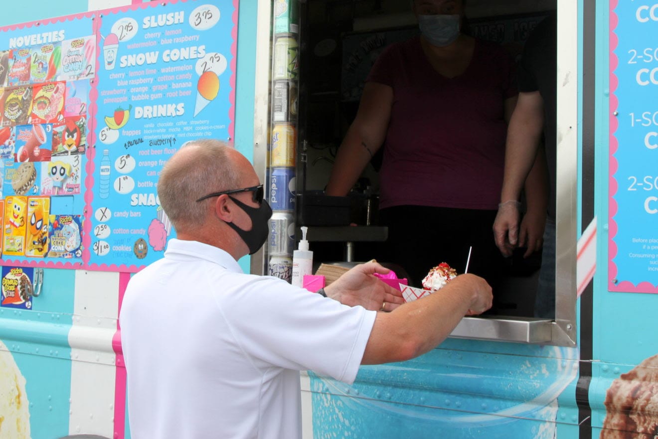 Avon Fire Chief Robert Spurr picks up his ice cream at the window. (Photo courtesy Town of Avon)
