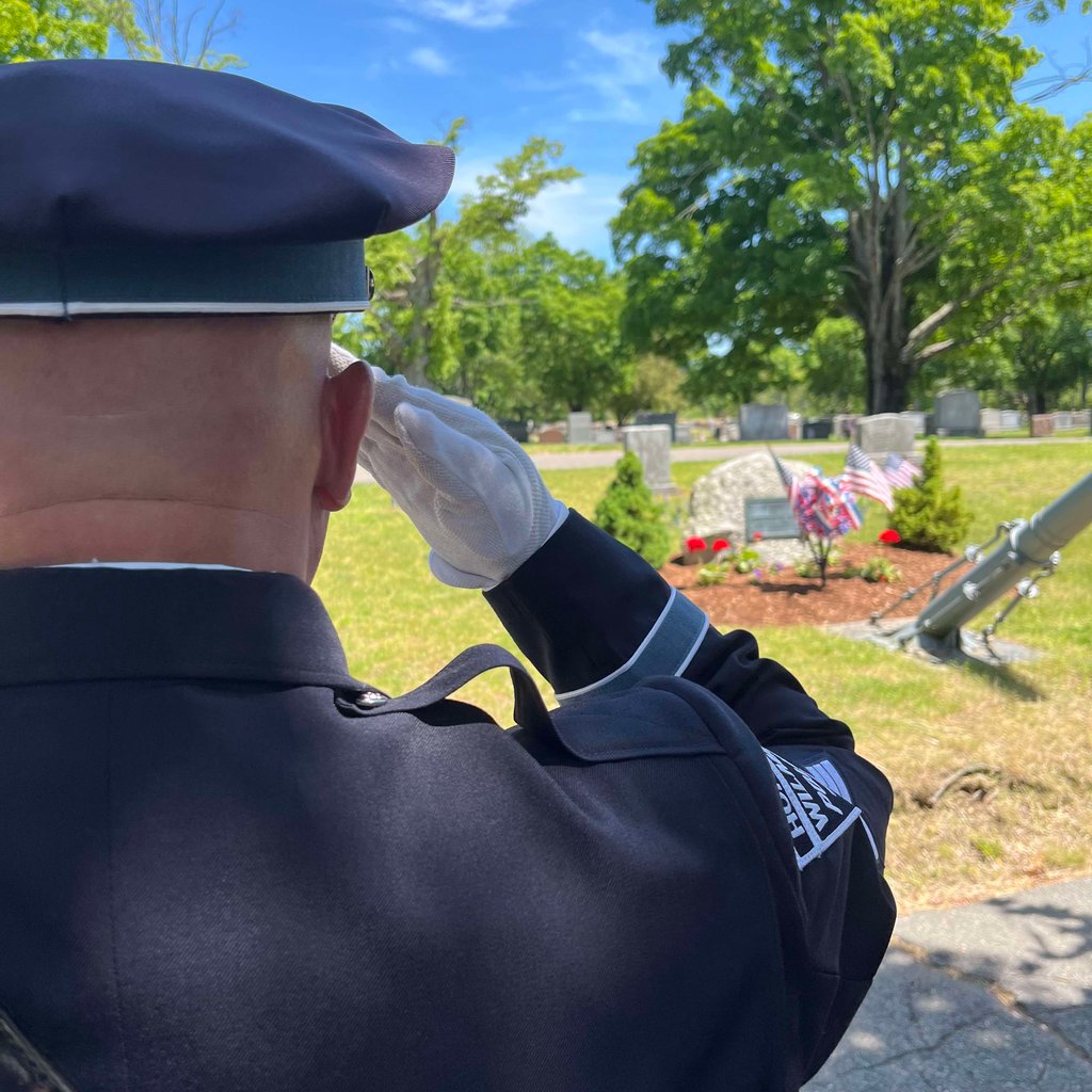 Honor Guard Member saluting.