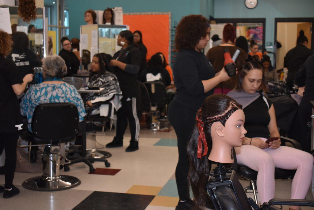 Students provided hair styles and manicures for women from the LARE Institute. (Photo courtesy of the Greater Lawrence Technical School)