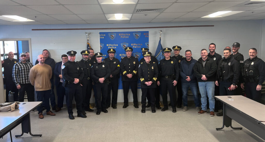 Members of the Billerica Police Department stand with retiring Deputy Jerry Roche and newly promoted Deputy Chief Glen Magnan.