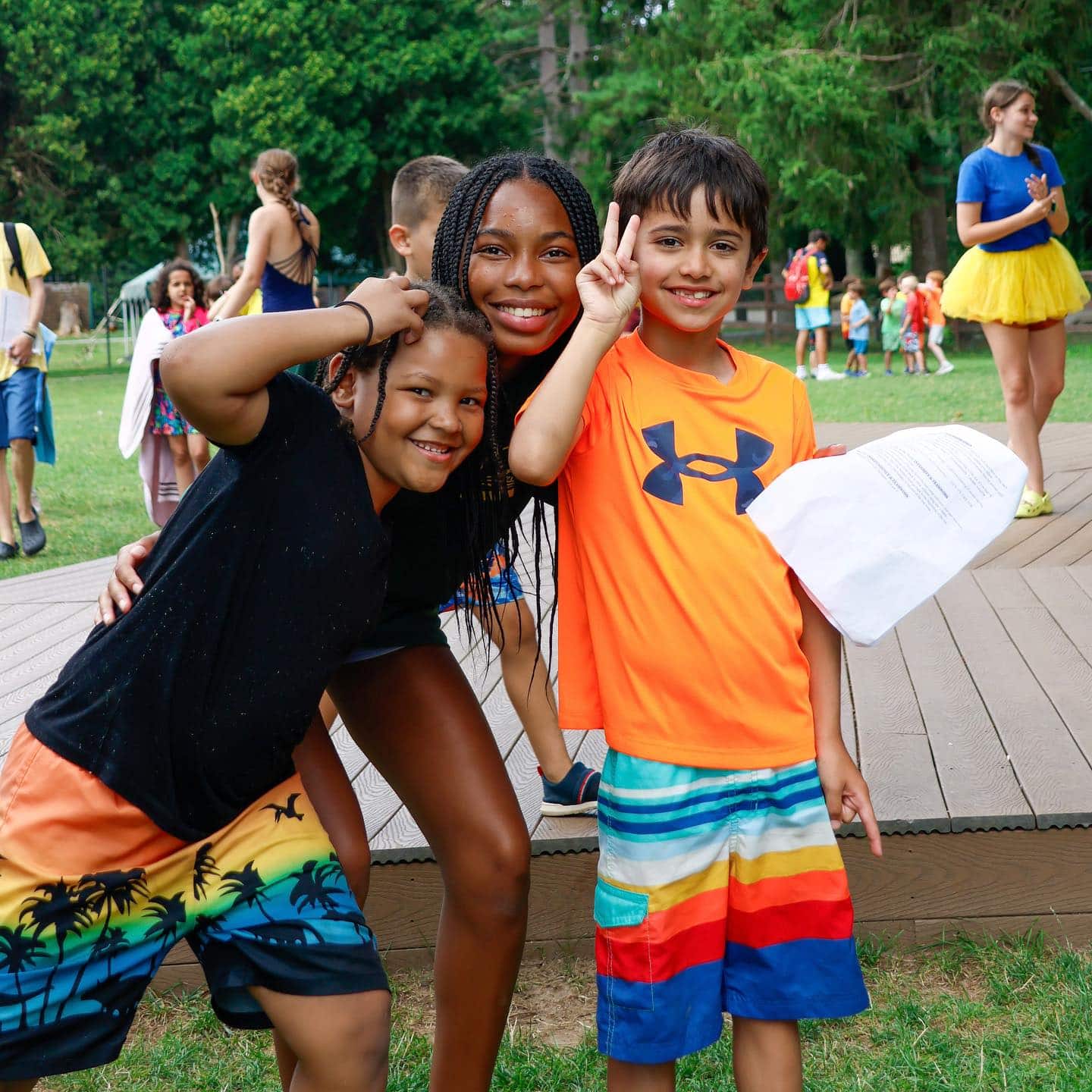 Three students pose while attending a summer enrichment program.