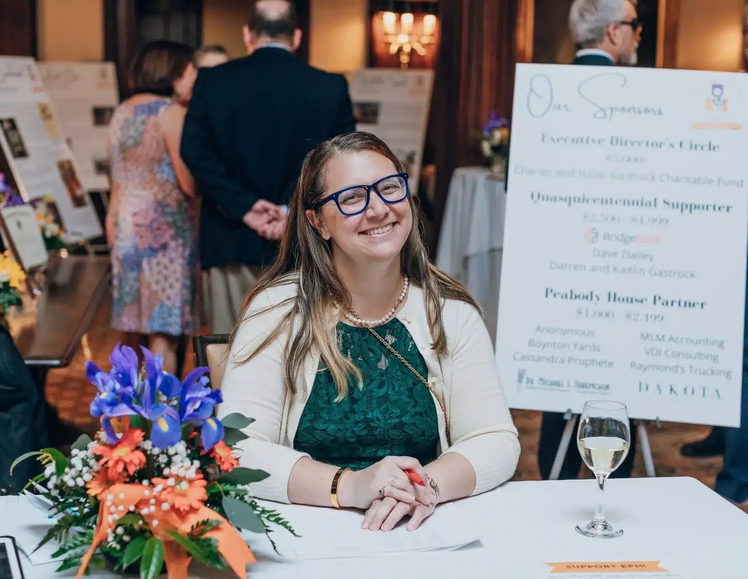A Board Member of the Elizabeth Peabody House volunteering at a donor event.