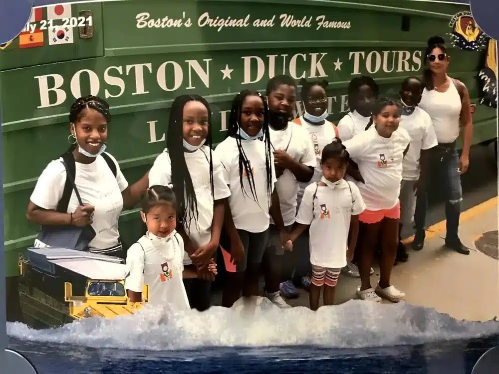 City Explorer participants stand in front of a Boston Duck Tour boat.