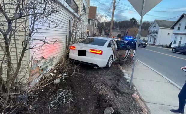 A car crashed into a home on Franklin Street in Stoneham on Friday after a vehicle pursuit. (Courtesy Stoneham Police Department)