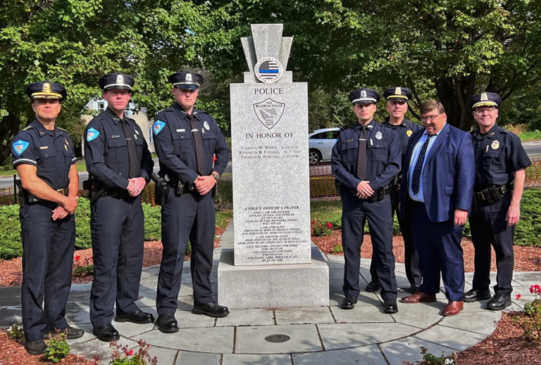 From left, Chief Roy Frost, Officer Brendan Nawn Fraser, Officer Christopher Walker, Officer Joseph LaMarca, Lt. Greg Katz, Town Manager John Curran, and Deputy Chief Jerry Roche stand together at the Billerica Police Memorial.