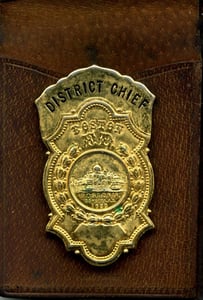 Badge of retired District Chief John L. Glynn, in 1950.