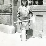 Ladderman Gilbert W. Jones, Ladder 15, with an axe and extinguisher, at quarters at 941 Boylston St., Back Bay, circa 1922.