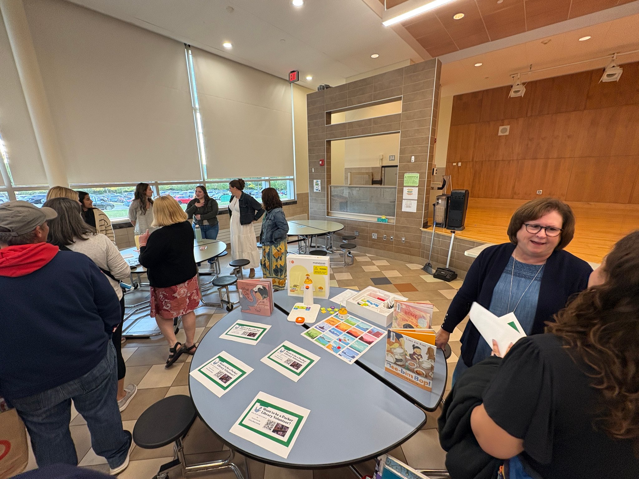 people at tables in cafe for back to school night