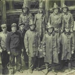 Group photo of members of Fireboat Engine 47, Captain John Williams, right front, circa 1922.
