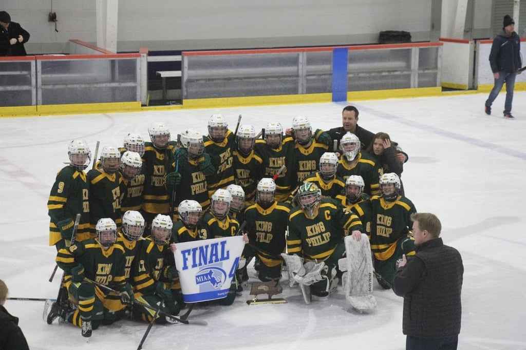 The King Philip Regional High School girls ice hockey team concluded a remarkable season Sunday morning with an appearance in the MIAA Division 2 State Championship game at TD Garden against Milton, capping a year defined by resilience after the passing of head coach Kenny Assad in December.