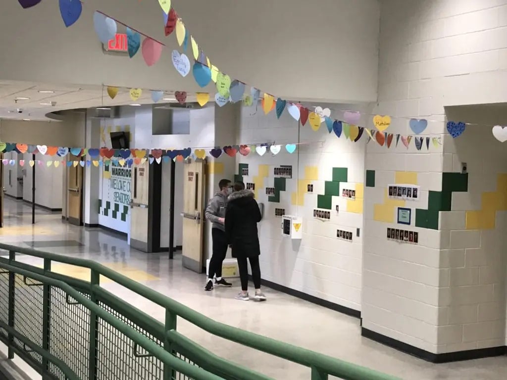 Students in KP Cares and the Student Council were given 10 hearts to decorate with the names of 10 seniors, which were then strung up across the lobby on display. (Photo courtesy King Philip Regional School District)