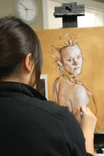 Art student sketching woman figure