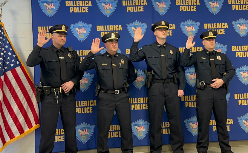 From left, Sergeants Stephen Cogswell, Andrew Devito, Cory Bandouveres, and Gilbert Ynostroza are sworn in as Billerica Police Department sergeants.
