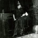 Ladderman Gilbert W. Jones, Ladder Co. 15, with an axe at quarters, 941 Bolylston Street, Back Bay, circa 1922.