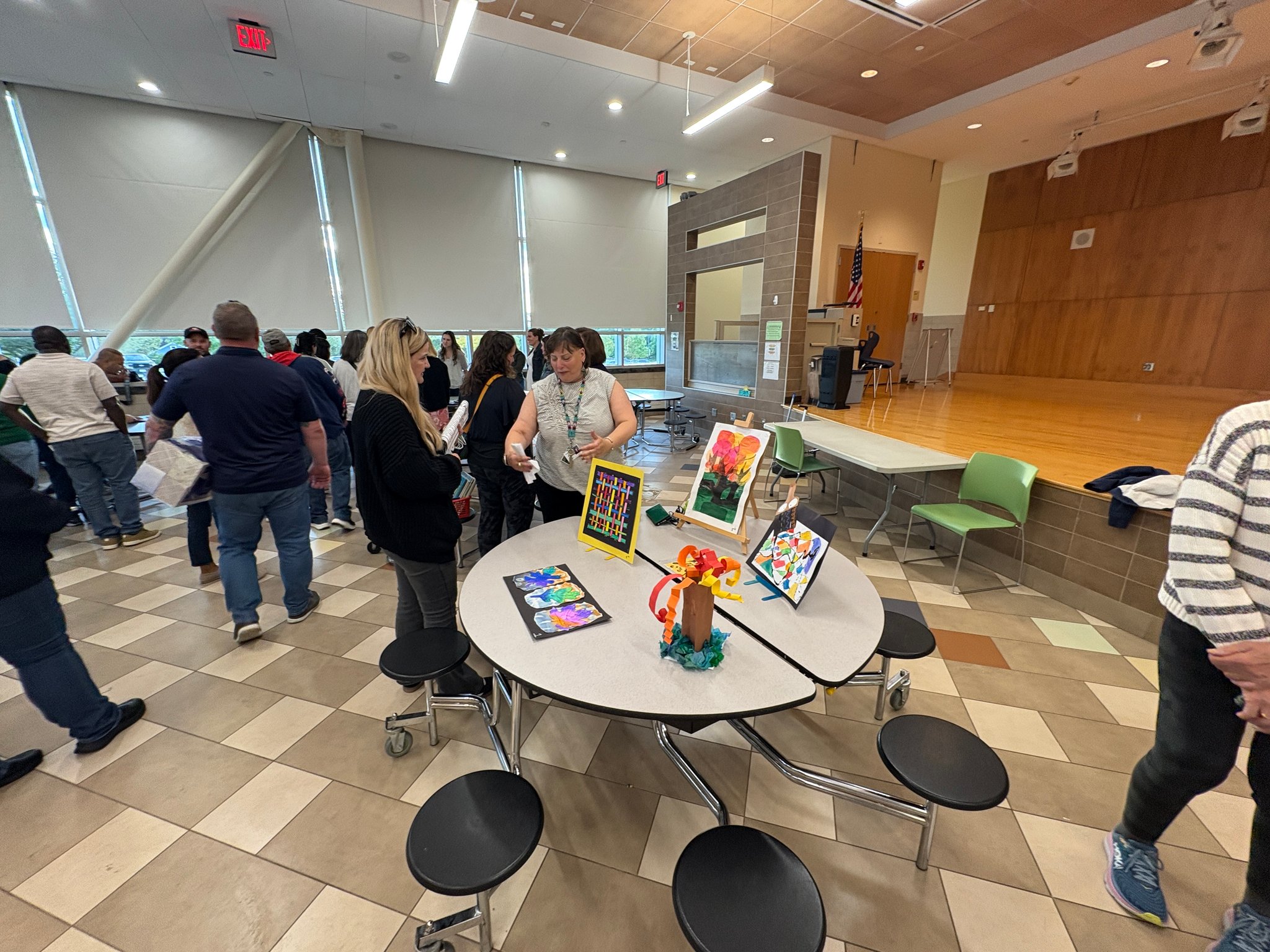 people at tables in cafe for back to school night