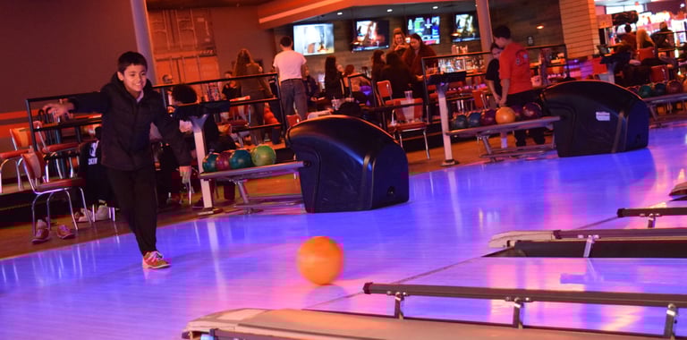 PHOTOS: Lowell Police Department Partners with Lowell Housing Authority to Take Youth Bowling