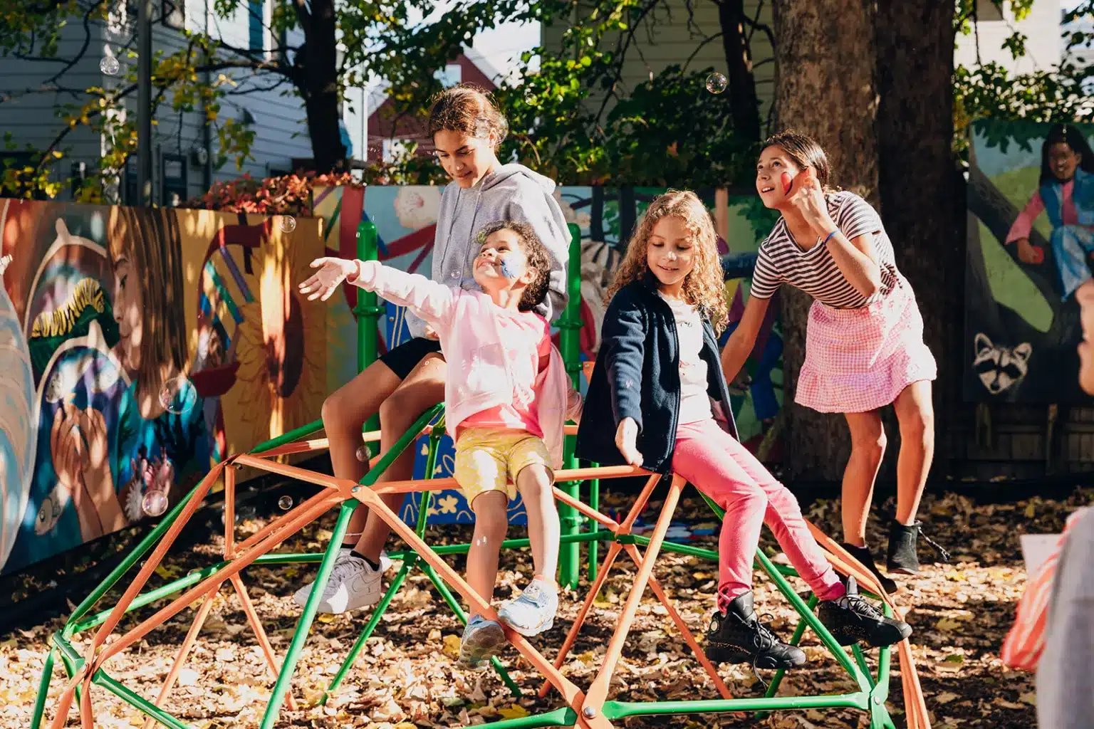 A group of students play on the EPH playground.