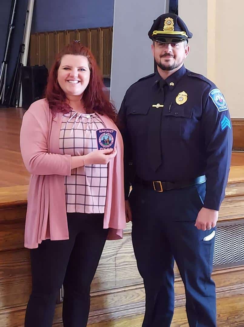 Melissa MacNeil, left, Development Director for the Susan G. Komen Foundation in Massachusetts, received the Nahant Police Department's "pink patch" from Sgt. Matthew Morneau.