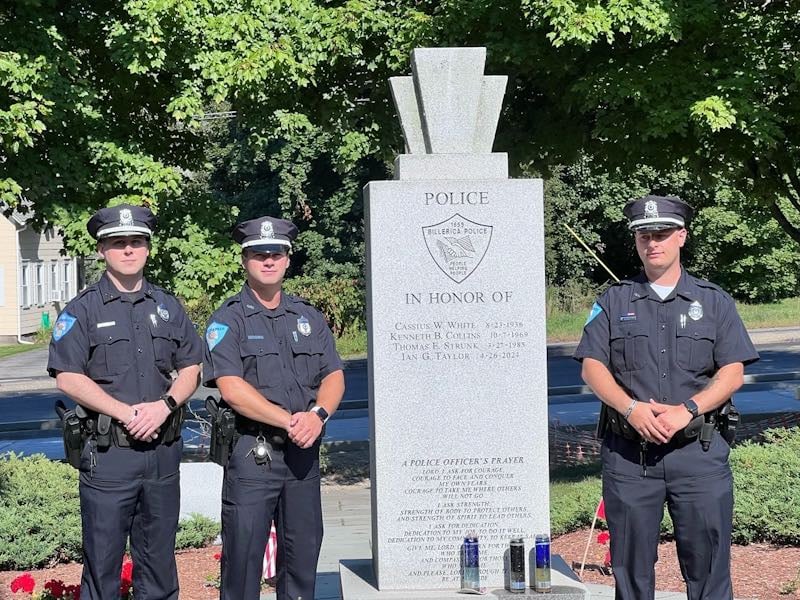 From left, new Billerica Police Officers Kyle Berry, John Duggan and Paul Garrity stand next to the Billerica Police Memorial outside of the police station and town hall.