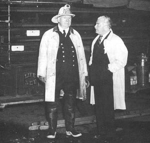 Chief of Department John McDonough and Boston Pops Conductor Arthur Fiedler, at an unknown fire, c. 1949.