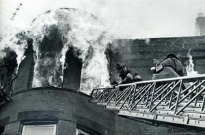 FF Leo McGonagle and Lt Guy Albanese, Engine 10, advance a line on St. Botolph St., So. End. Oct., 1976.
