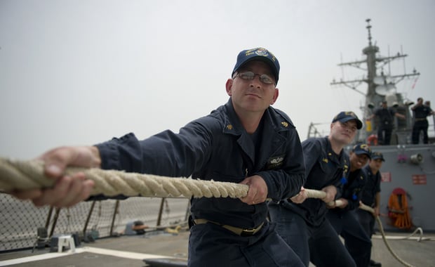 MANAMA, Bahrain (May 10, 2014) Chief Machinist's Mate Donald Morrissey, from Brockton, Mass., heaves a mooring line as the guided-missile destroyer USS Arleigh Burke (DDG 51) arrives for a scheduled port visit in Manama, Bahrain. Arleigh Burke is deployed in the U.S. 5th Fleet area of responsibility supporting maritime security operations and theater security cooperation efforts. (U.S. Navy photo by Mass Communication Specialist 2nd Class Carlos M. Vazquez II/Released)