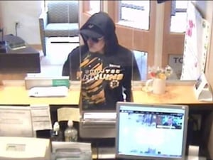 Arlington Police are investigating a bank robbery at the Winchester Savings Bank. If anyone recognizes the individual in the photo above, they are asked to contact the Arlington Police Department at 781-643-1212. (Surveillance Photo/Arlington Police Department)