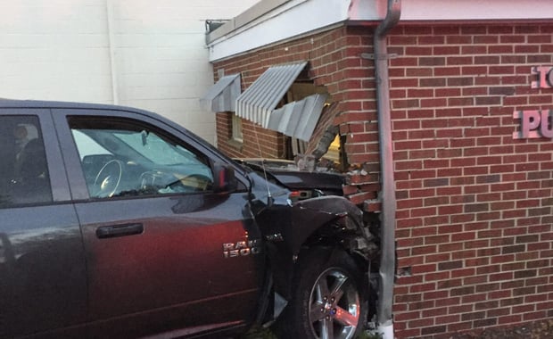 A Ram 1500 crashed into the Dracut DPW building on Saturday, causing extensive damage to the structure. (Dracut Police Department/Courtesy Photo)